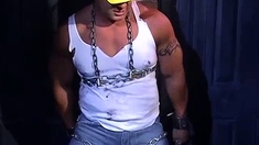 Muscular Construction Worker Is Bound Up With Chains