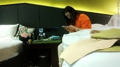 Cute amateur asian web cam girl playing with her toy
