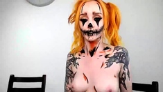 Glamourous redhead toys ass solo
