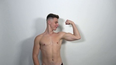 Muscle boy Jonathan Hicks shows his abs